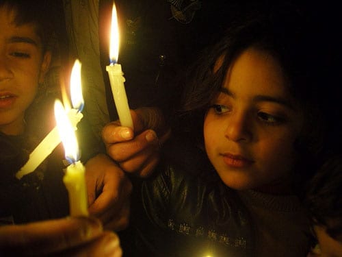 child with candle