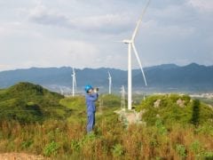 Apple China Clean Energy Fund invests in wind farms team member looking across landscape 082619